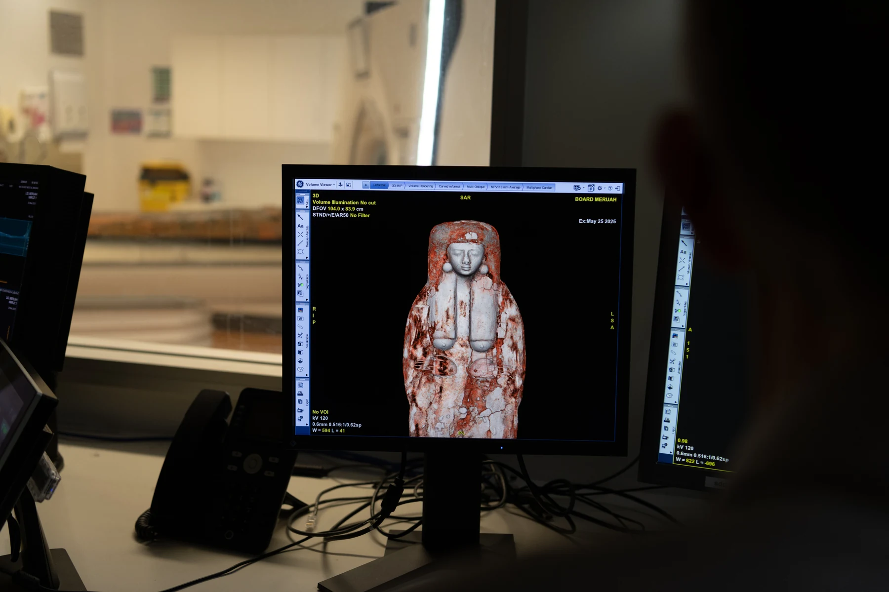 CT scan results showing 3D model of mummy on control room monitor