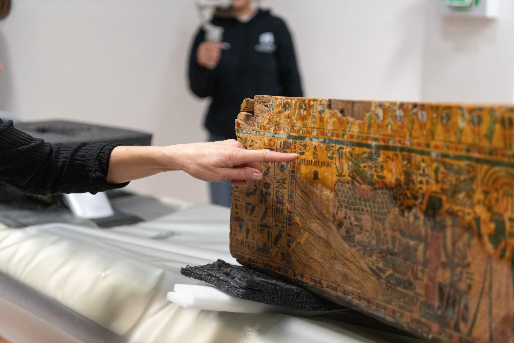 Researchers examining the coffin