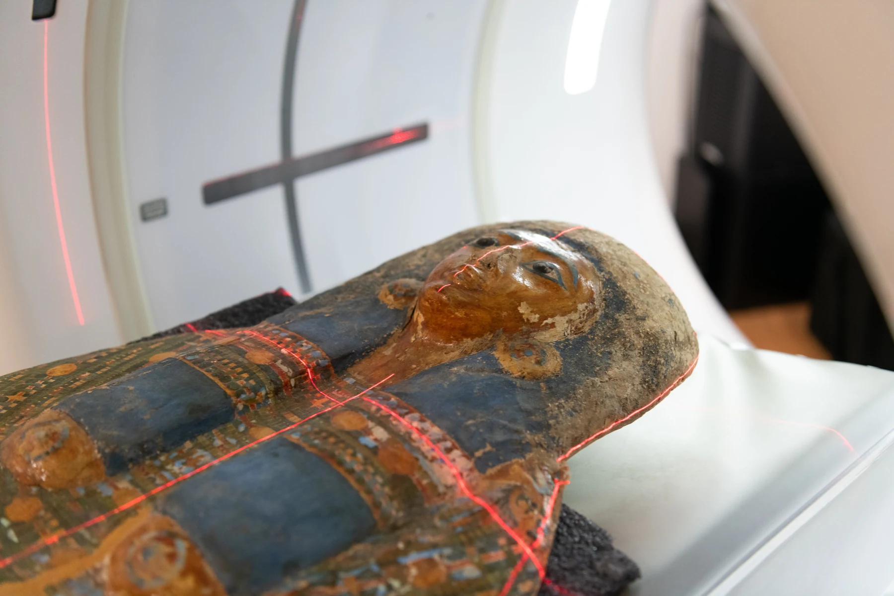 Coffin being loaded into the CT scanner